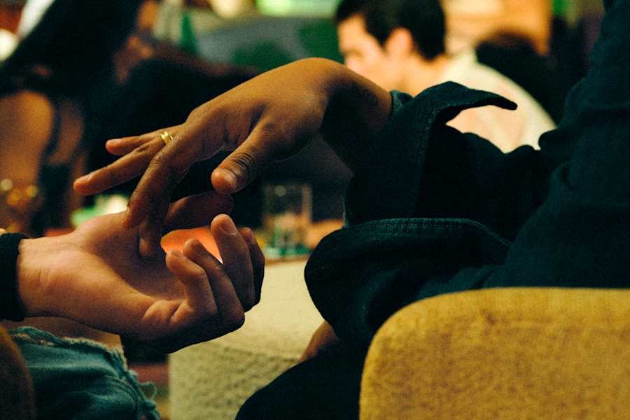 Two people touching hands